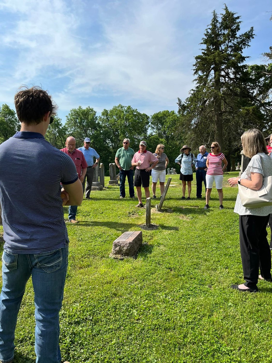 People gather in St. Patrick Cemetery in St. Patrick on Memorial Day for the blessing of graves and for guided tours.
